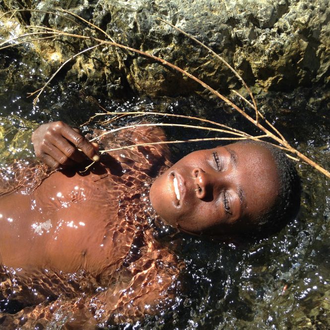 A boy closes his eyes for a moment to enjoy the rushing water as he  bathes in a small stream along the border between Haiti and the Dominican Republic. This is the same stream that is used by livestock and to collect drinking water.For decades, Haitians have sought an escape from crippling poverty, political violence and social turmoil fueled by successive dictatorships and failed attempts at effective democratic government. The 2010 earthquake only made economic matters worse as Haiti still struggles to overcome that disaster. Pressed into the fringes of their nation and desperate for a better life, Haitians cross the border to find that they are unwelcome in the Dominican Republic and pressed back into the fringe with the implied fear of deportation. Many are not legal citizens of either country because they are too poor to afford the proper registration paperwork and fall outside what little safety net the governments have to offer. Unwilling to go backward and unable to move forward, the result is thousands of people living along a rural, open border, trapped by the invisible walls of their own poverty and their inability to participate as citizens. They have been marginalized by the governments of both nations and, for all intents and purposes, are people without a country who are invisible and forgotten.